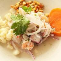 Ceviche Mixto · Fresh fish and seafood marinated in lime juice, Peruvian spices and herbs. Served with glaze...
