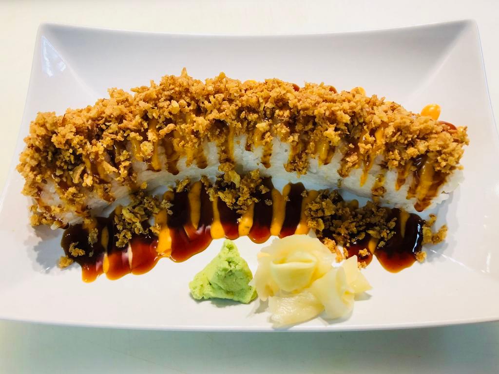 Crunch Tempura Roll · Inside the roll includes crab, Avocado, and tempura shrimp with spicy mayo and sweet sauce with crunchy onion flakes on the top. (8 pieces)