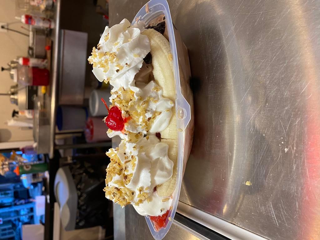 Banana Boat · Choose 3 flavors of ice cream and 3 toppings served with  whipped cream and nuts 
