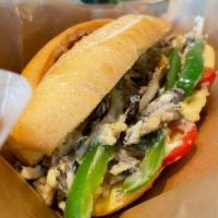 Veggie Melt · French roll filled w/ peppers, onions and mushrooms topped w/ plant-based cheese w/ veggie m...
