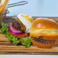 Champions Burger Reloaded · Angus beef, arugula, tomato, onion, yellow cheddar cheese, fried egg, bacon jam and served w...