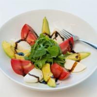 Avocado Capresse Salad · Avocado, arugula, tomato, basil and fresh mozzarella with glazed and olive oil.