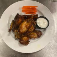 Chicken Wings · Buffalo or BBQ sauce, served with blue cheese or ranch dressing.
