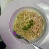 Spaghetti Carbonara · Served with pancetta, eggs, Parmesan, cream and ground black pepper.