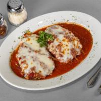 Eggplant Parmesan · Served with side of mostaccioli.