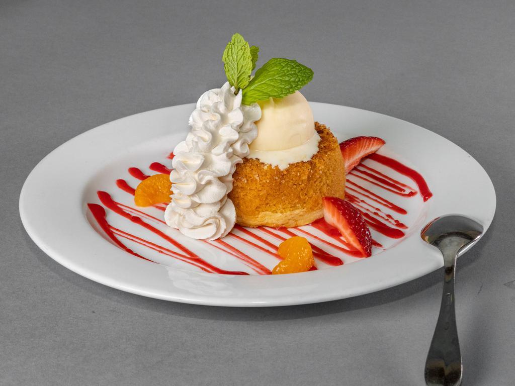 Imperio Cake · Butter cake, fresh strawberry, fresh orange, raspberry reduction graze.