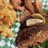 Salmon and Shrimp Tackle Box · Blackened Salmon Fillet, and 3 large Shrimp served over yellow cilantro rice, and finished i...