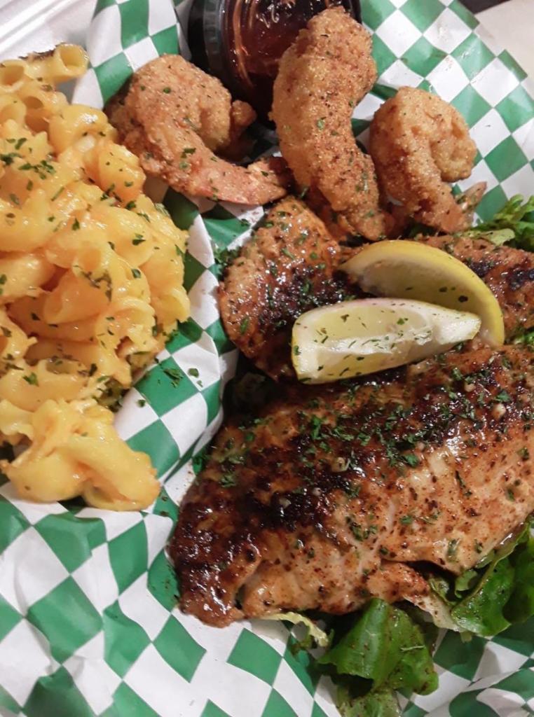 Salmon and Shrimp Tackle Box · Blackened Salmon Fillet, and 3 large Shrimp served over yellow cilantro rice, and finished in our signature garlic butter.