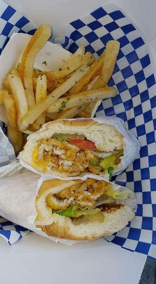 Catfish Po Boy · Fried catfish fillet, lettuce, tomatoes, pickles, onions, cheese, served on a soft roll, with choice of signature sauce.