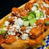 Buffalo Chicken Po Boy · Hand breaded chicken breast strips tossed in our signature Buffalo sauce, topped with crumbl...