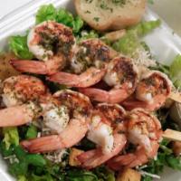 Shrimp Caesar Salad · Crisp romaine, tiger shrimp, fresh Parmesan, signature Caesar and croutons.