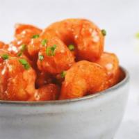 Dynamite Shrimp · Wild-caught large shrimp fried to a perfect crisp and tossed in our creamy sweet chili sauce.