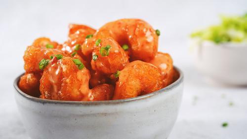 Dynamite Shrimp · Wild-caught large shrimp fried to a perfect crisp and tossed in our creamy sweet chili sauce.