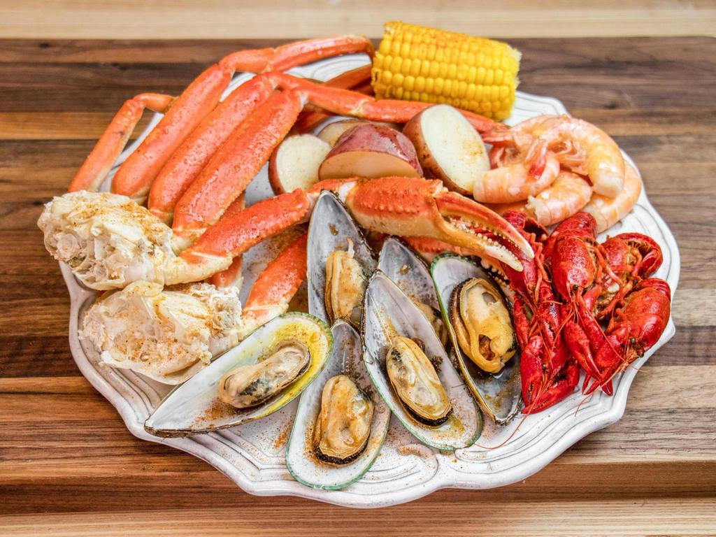New! Crab Leg Boil (small) · 1 snow crab cluster, 7 large shrimp, 7 Green Shell mussels, 7 crawfish, corn, potato, broccoli, Cajun sauce