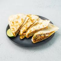 Impossible Chorizo Quesadilla · Beyond chorizo, pickled onion, melted cheddar-jack cheese, cilantro, cotija cheese.
Vegetari...