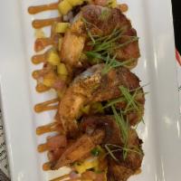 Camarones · Shrimp wrapped in bacon habanera cheese and cilantro mango relish finished with chlpotle aio...