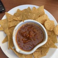 Chips & Salsa · House salsa chipotle and home-made corn tortilla chips.