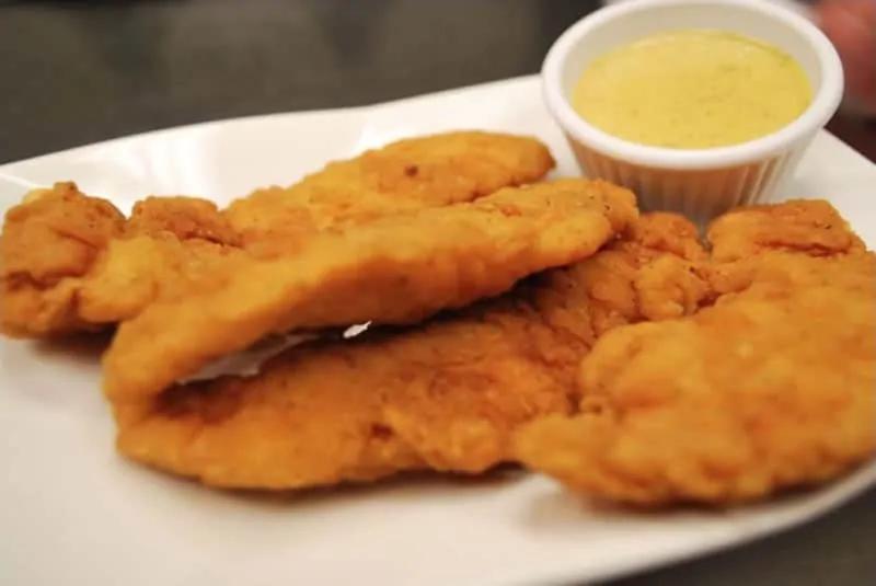 Chicken Tenders  · All-white meat chicken lightly breaded and fried to a golden brown. Served with honey mustard. 