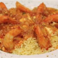 Shrimp Santorini · Jumbo prawns sautéed in olive oil with tomatoes, onions, capers, olives, garlic and crumbled...