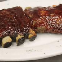 BBQ Ribs  · Meaty St. Louis ribs basted with sweet baby ray's sauce. Served with 2 side. 