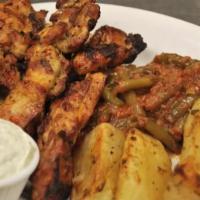 Chicken Souvlakia · Served with tzatziki and pita bread. Served with 2 sides of your choice.