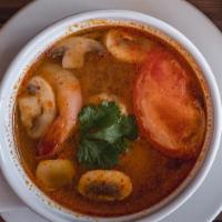Shrimp Tom Yum · The famous Thai hot and sour soup with chopped tomato, red onion, lemongrass, lime leafs, mu...