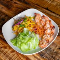 Grilled Shrimp Mango Salad · Grilled shrimp, red onion, crispy shallot, cilantro, scallion, and roasted peanut in mango l...