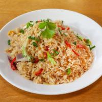 Fried Rice · Wok fried rice with egg, red onions, green cabbage, and green onions.
