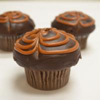 Caramel Comfort · Chocolate cake with caramel in the center, dipped in fudge with caramel drizzled on top. 