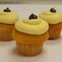 Monkey Mania · Banana cake filled with caramel, topped with cream cheese frosting. 