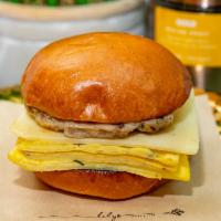Sausage & Egg Sandwich · Chicken and maple sausage (contains pork), scrambled egg, gruyere cheese, maple ketchup, and...