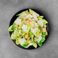 Classic Caesar's Salad  · Romaine lettuce, croutons, parmesan cheese , onions , tomatoes and a creamy Caesars dressing.
