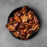 50 Pieces Classic Chicken Wings · 50 pieces of our traditional chicken wings with over 10 sauces and dips to choose from 
