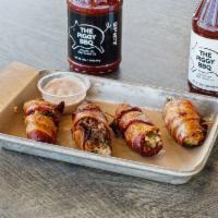4 Hopper's Popper's · Fresh Jalapeno Halves stuffed with Pulled Pork, Wrapped in Bacon.  Raspberry Chipotle Cream ...