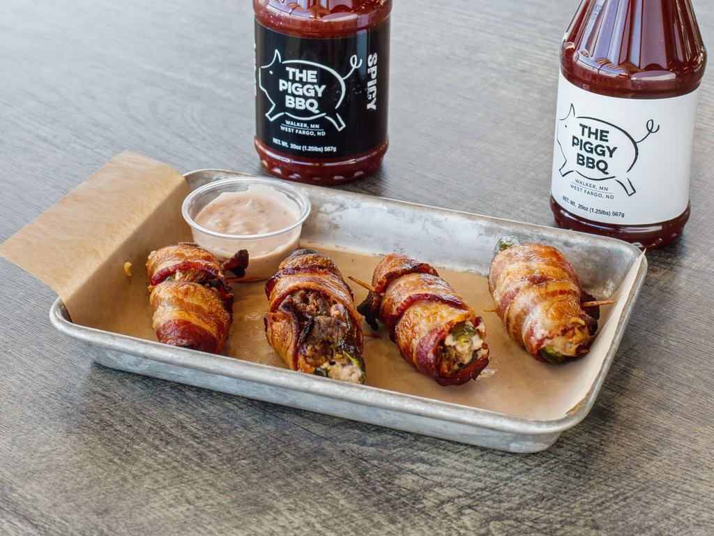 4 Hopper's Popper's · Fresh Jalapeno Halves stuffed with Pulled Pork, Wrapped in Bacon.  Raspberry Chipotle Cream Cheese Dipping Sauce on the Side.