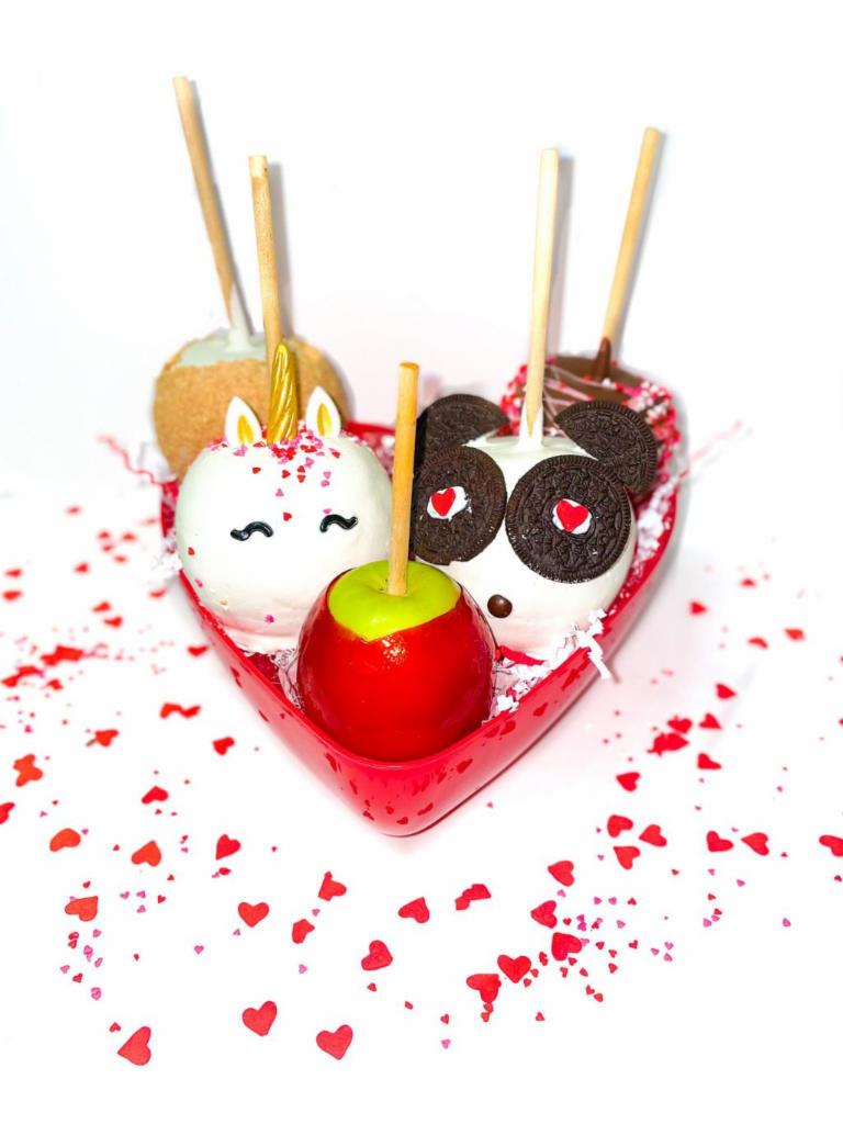 Valentine's Day Apple Platter · This special edition apple platter comes with ALL 5 of our Valentine's Day Themed Apples: Red Candy Unicorn Strawberry Shortcake Panda Apple And our Milk Chocolate Apple with Sprinkles