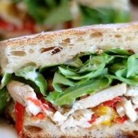 Chicken Panini* · Chicken breast and baby arugula with bell peppers, thyme, Sicilian capers, and rosemary mayo...