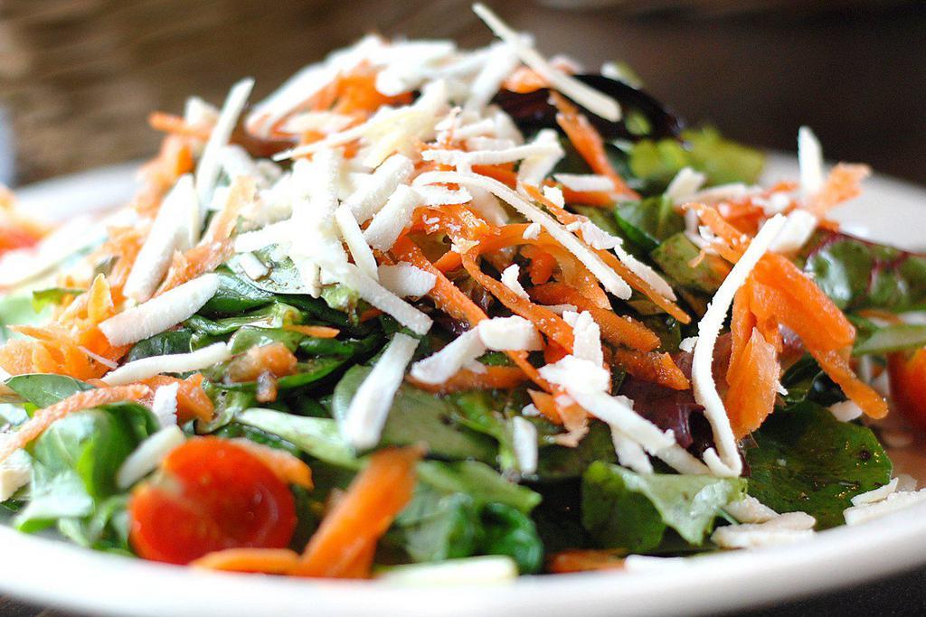 Mista di Campo* · Mixed greens, cherry tomatoes, carrots and olives with a balsamic vinaigrette and shredded ricotta cheese. 
