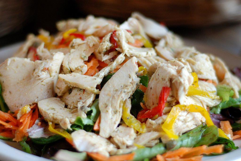 Tuscan Chicken Salad* · Grilled chicken breast over mixed greens, bell peppers, capers, onions and thyme with a balsamic vinaigrette. 