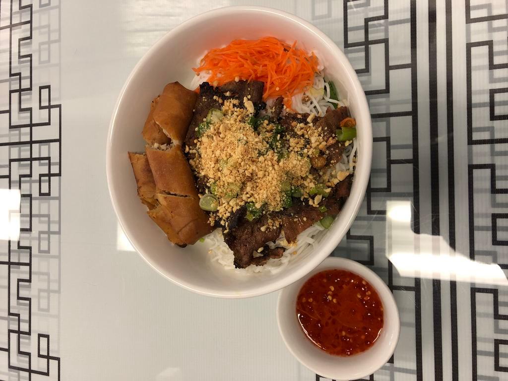 E15. Bun Cha Gio Thit Nuong · Grilled pork and imperial rolls serve with vermicelli. 