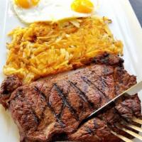 Steak and Eggs · Rib-eye steak, 2 eggs any style, served with roasted potatoes, hash browns or house made chi...