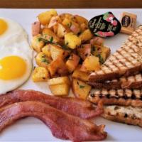 Two Egg Breakfast · Eggs any style, served with roasted potatoes, hash browns, house made chips or fruit, toast ...