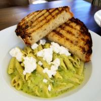 Penne Pesto · Penne pasta tossed in our homemade creamy Pesto sauce topped with ricotta.