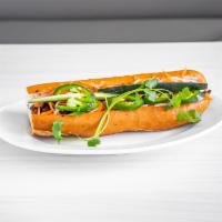 GRILLED PORK BANH MI · GRILLED PORK STUFFED IN A FRENCH BAGUETTE SERVED WITH VIETNAMESE HERBS AND PICKLED VEGGIES (...