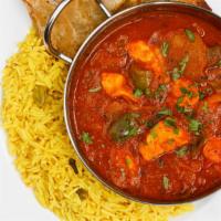 Chicken Jalfrezi · Marinated chicken cooked with farmers market fresh tomatoes, bell peppers, and onions in a a...