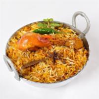 Chicken Biryani · Fresh chicken marinated in Indian spices on a bed of basmati rice.