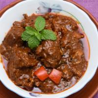 Beef Jalfrezi · Marinated beef cooked with farmers market fresh tomatoes, bell peppers, and onions in a auth...