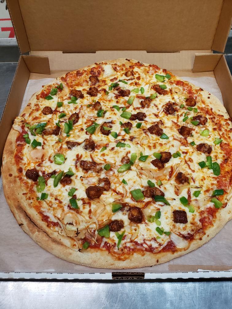 Extra Large BBQ Vegetarian Chicken Pizza · Sweet and tangy BB sauce, vegan chicken cubed, onions, green peppers, and our signature cheese blend.