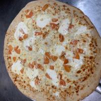 Extra Large Roasted Garlic, Ricotta & Tomato Pizza · Ricotta, fresh garlic, and fresh diced tomato and onions sliced covered with our cheese blen...