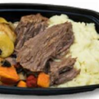 Classic Pot Roast · Classic pot roast served on buttery mashed Yukon potatoes with a blend of seasoned vegetable...